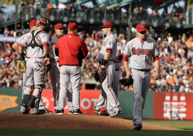 Arizona Diamondbacks' Allen Webster, right, leaves the baseball game against the San Francisco Giants in the sixth inning Saturday, June 13, 2015, in San Francisco. (AP Photo/Ben Margot)