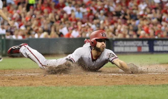 Arizona Diamondbacks' Ender Inciarte slides into home to score on a single by A.J. Pollock during the fifth inning of a baseball game against the Cincinnati Reds, Thursday, Aug. 20, 2015, in Cincinnati. (AP Photo/Gary Landers)