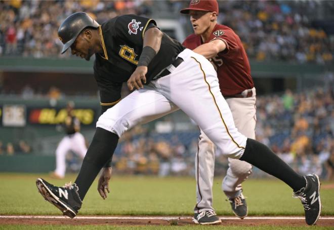Pittsburgh Pirates' Gregory Polanco is tagged out by Arizona Diamondbacks shortstop Nick Ahmed during the second inning of a baseball game on Wednesday, Aug. 19, 2015, in Pittsburgh.  (AP Photo/Fred Vuich)