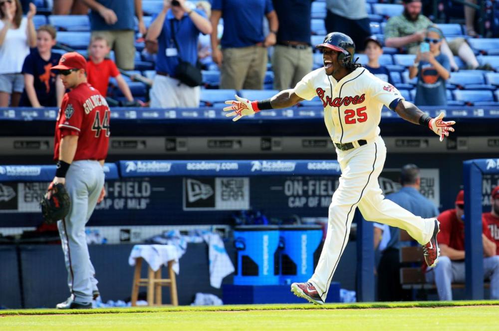 ATLANTA, GA - AUGUST 16: Cameron Maybin #25 of the Atlanta Braves celebrates a walk off home run in the tenth inning against the Arizona Diamondbacks at Turner Field on August 16, 2015 in Atlanta, Georgia. (Photo by Daniel Shirey/Getty Images)