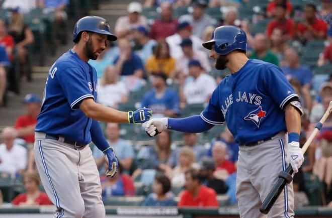 Toronto Blue Jays' Chris Colabello, left, celebrates his solo home run with teammate Kevin Pillar during the first inning of a baseball game against the Texas Rangers, Tuesday, Aug. 25, 2015, in Arlington, Texas. (AP Photo/Tony Gutierrez)
