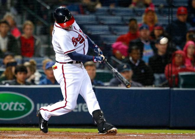 Atlanta Braves Daniel Castro hits a solo home run in the third inning of a baseball game against the St. Louis Cardinals, Friday, Oct. 2, 2015, in Atlanta. (AP Photo/Todd Kirkland)